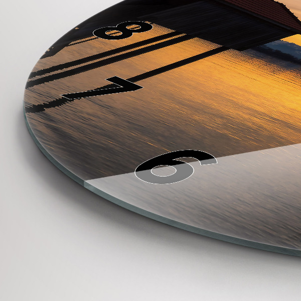 Round glass wall clock Sunset over the lake