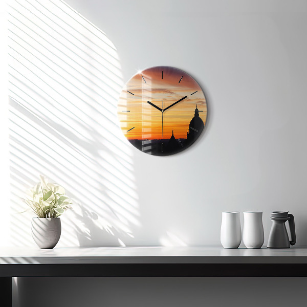 Round glass wall clock Building and sunset