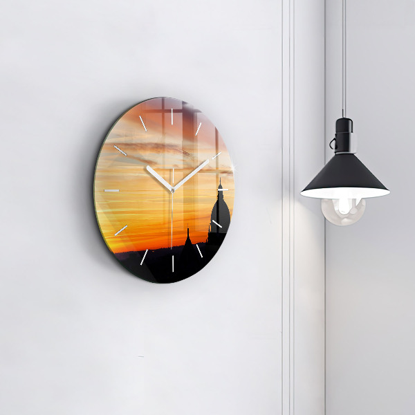 Round glass wall clock Building and sunset