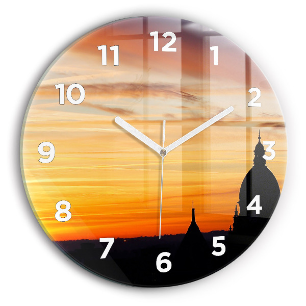 Round glass wall clock Building and sunset