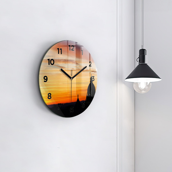 Round glass wall clock Building and sunset