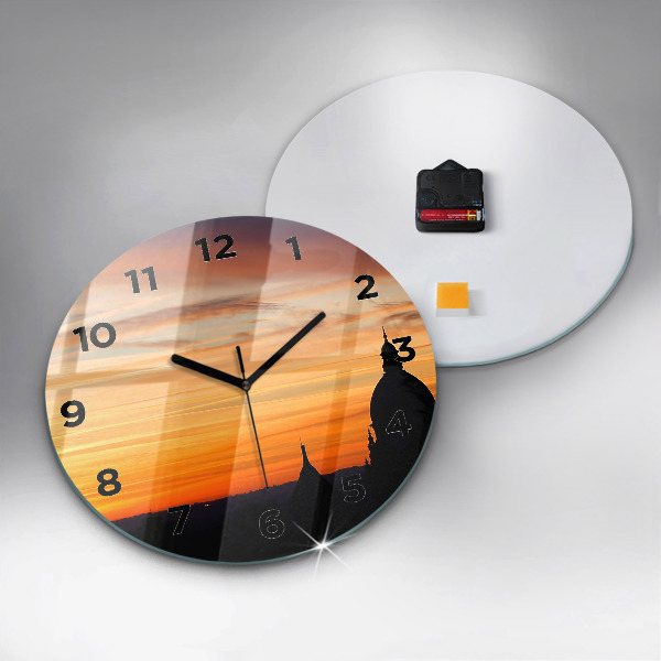 Round glass wall clock Building and sunset