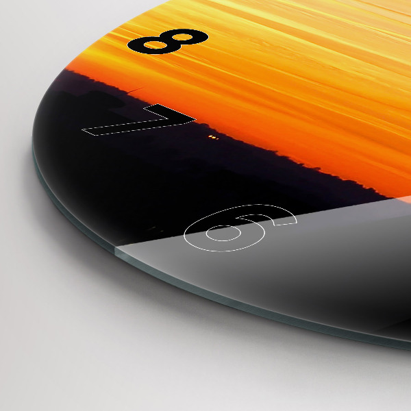Round glass wall clock Building and sunset