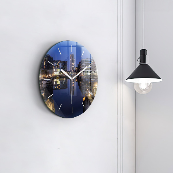 Round glass wall clock The city lit up at night