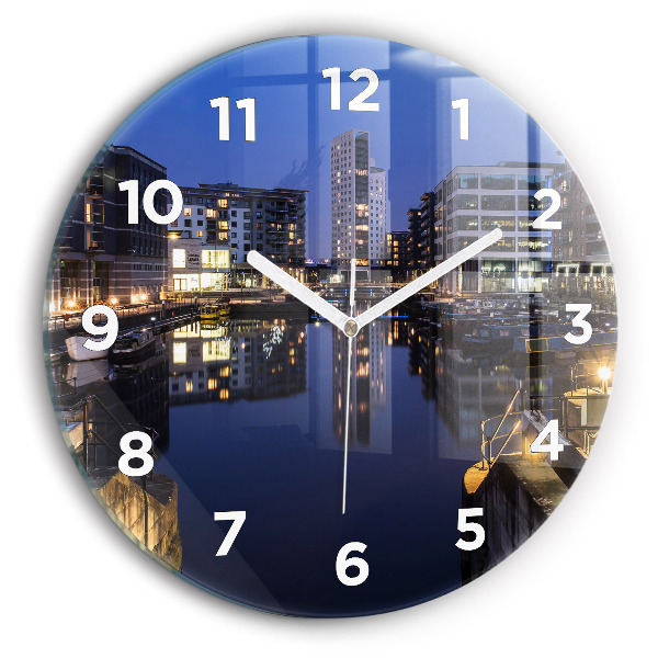 Round glass wall clock The city lit up at night