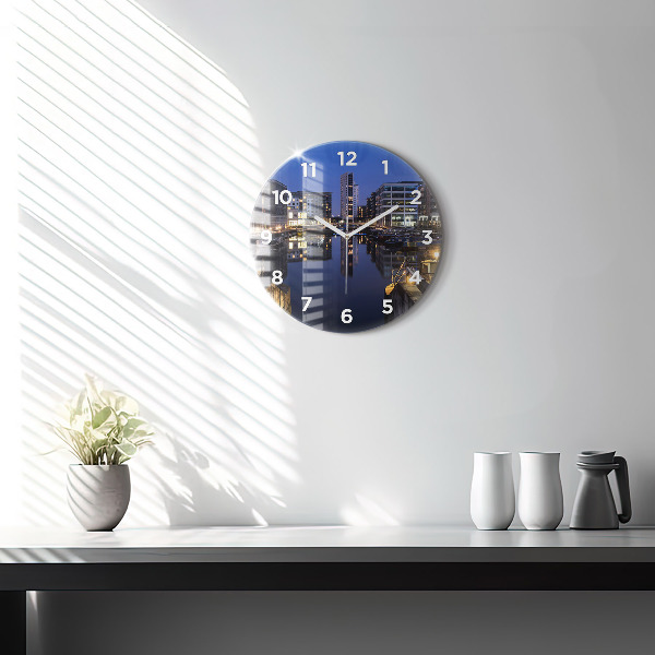 Round glass wall clock The city lit up at night