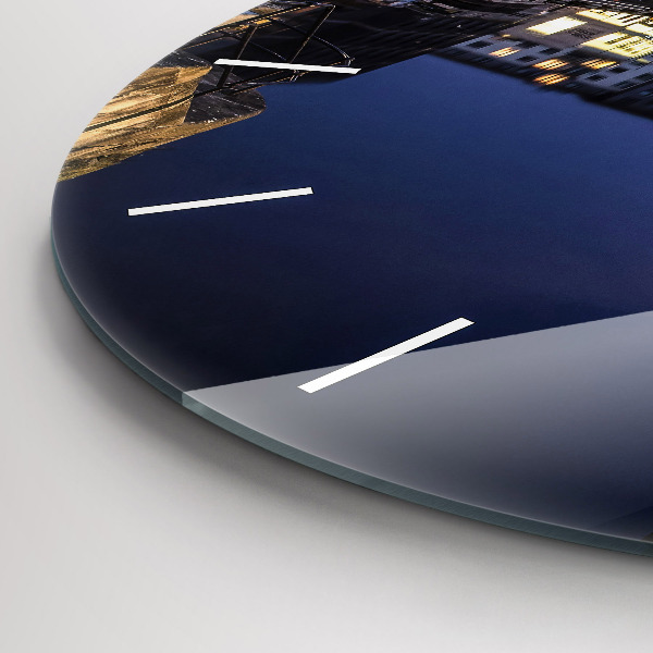 Round glass wall clock The city lit up at night