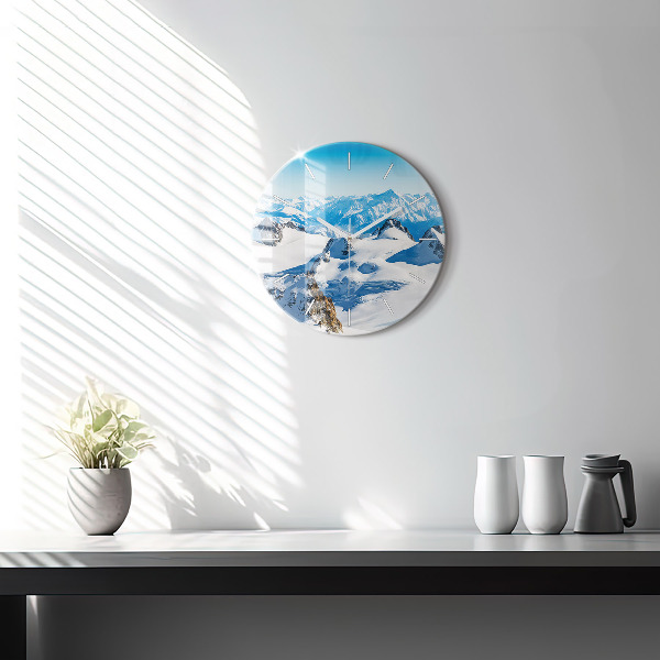 Round glass wall clock Skier in the Alps