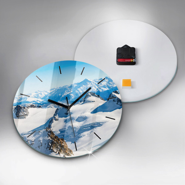 Round glass wall clock Skier in the Alps