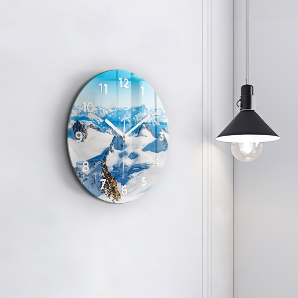 Round glass wall clock Skier in the Alps
