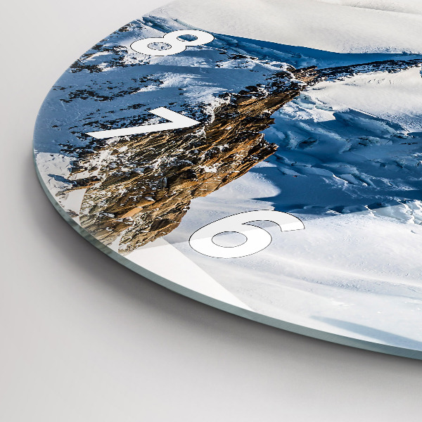 Round glass wall clock Skier in the Alps