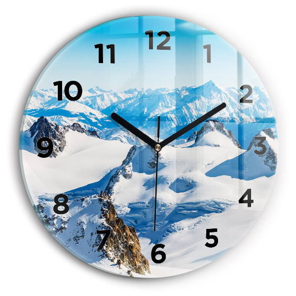 Round glass wall clock Skier in the Alps