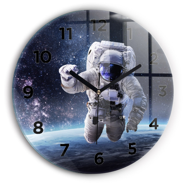 Round glass wall clock Astronaut above the earth