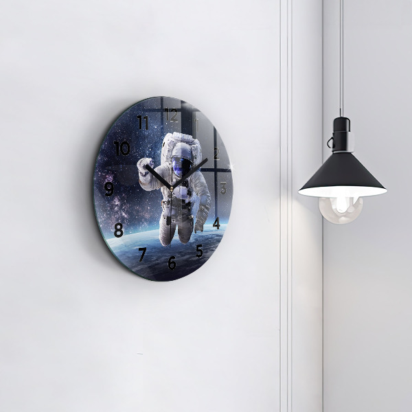 Round glass wall clock Astronaut above the earth