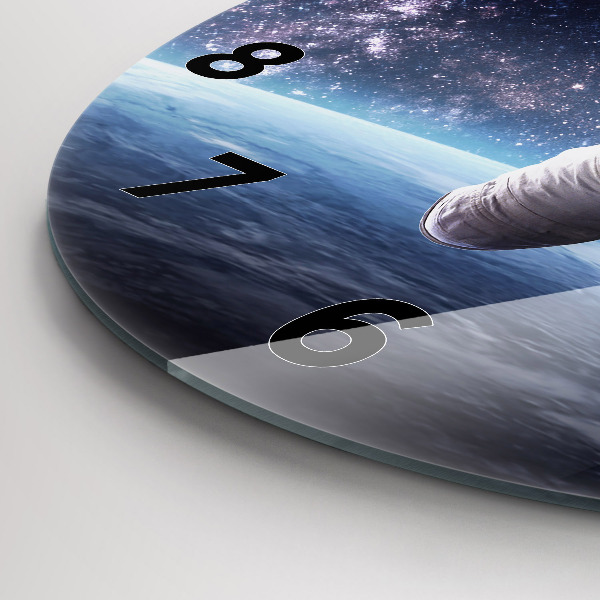 Round glass wall clock Astronaut above the earth