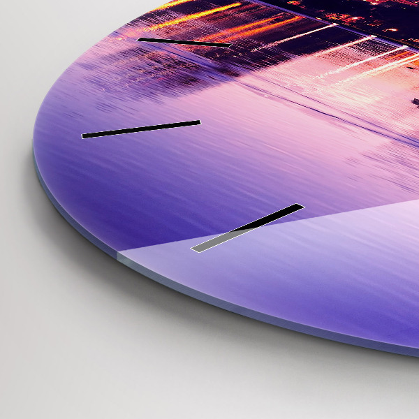 Round glass wall clock Evening panorama of the city