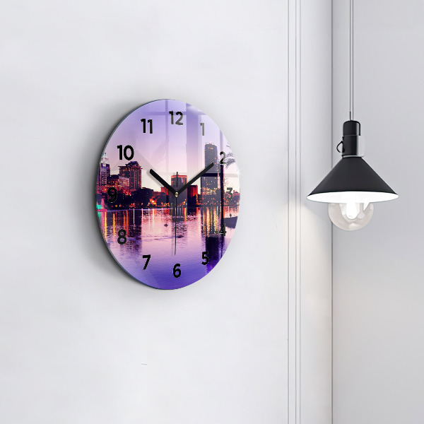 Round glass wall clock Evening panorama of the city