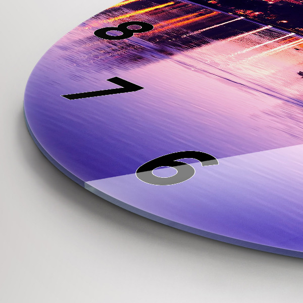 Round glass wall clock Evening panorama of the city